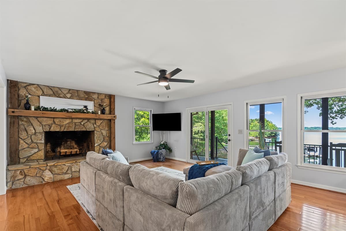 Relax in the open living room with scenic Lake Norman views and cozy seating.