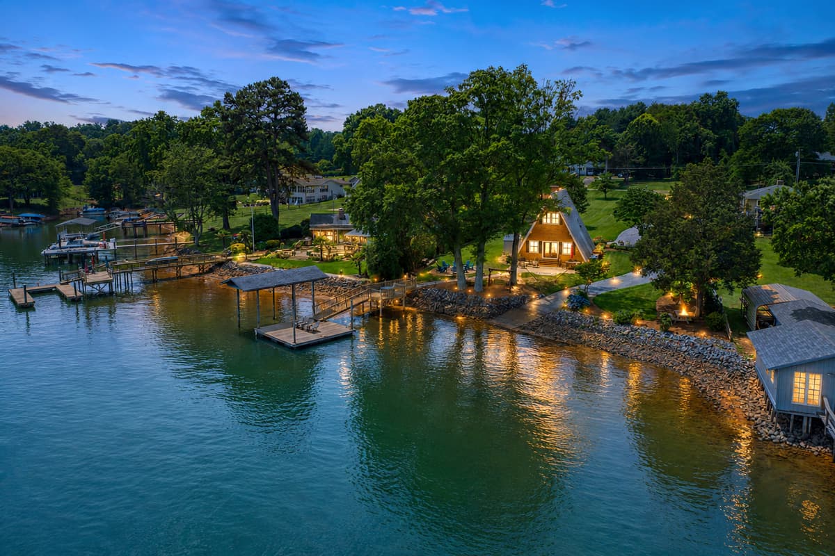 Launch Point glows at dusk, docks lit and reflecting off the calm water.
