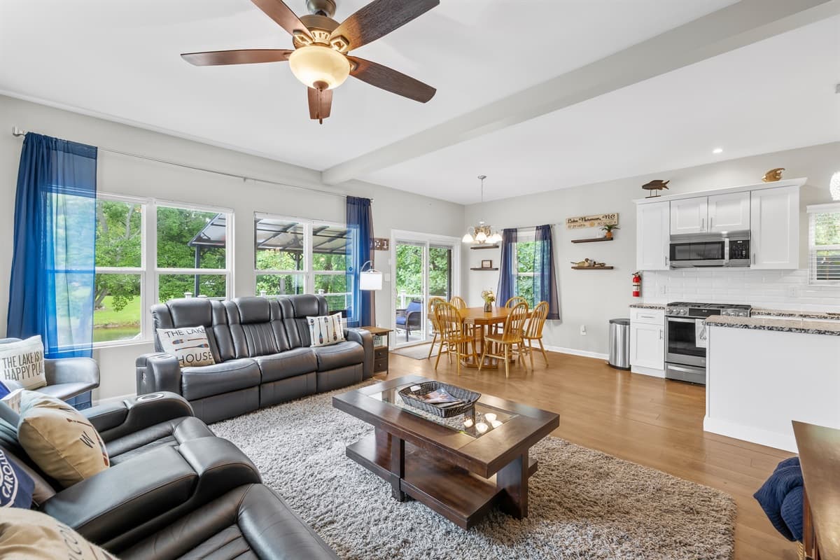 An open, airy living room with pops of blue — comfortable seating for the whole group.