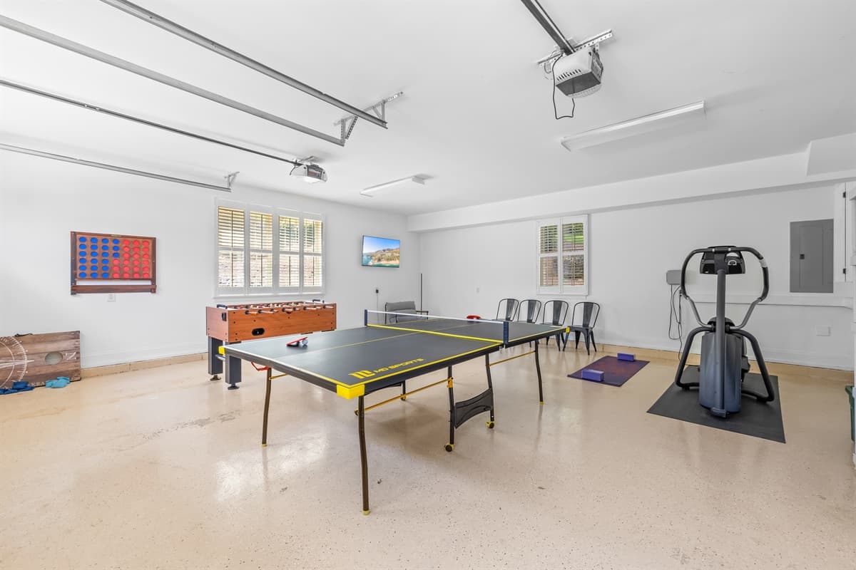 Head into the garage to enjoy into a fully loaded game room with ping pong, foosball, Connect 4, and a smart TV. 