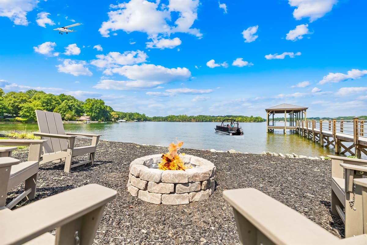 Gather around the fire pit that overlooks the water. 