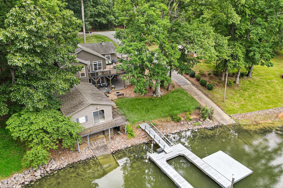 Your lakefront retreat! Reach out to us right away with any questions! A boat now lives inside the boat slip - but additional parking is on the side with cleats.