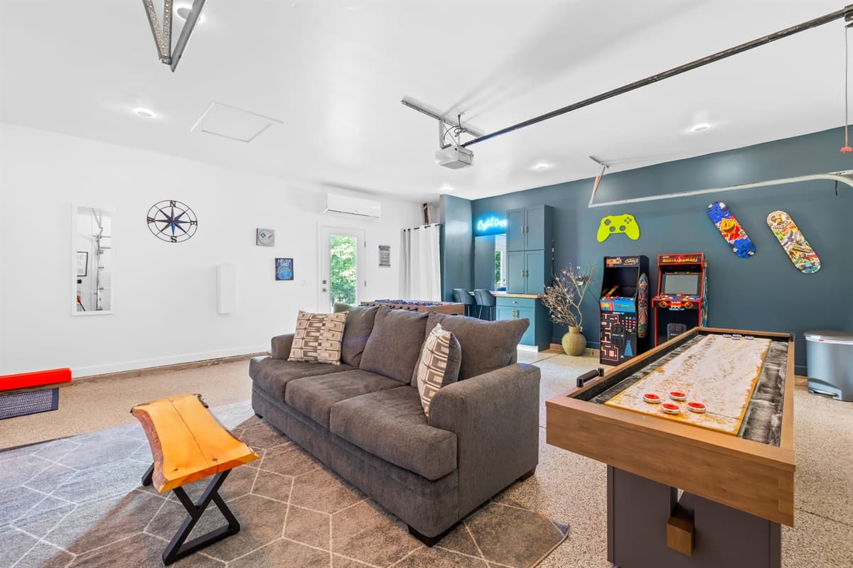 Brand new game room with shuffleboard, arcade, foosball, Smart TV, desk and more!
