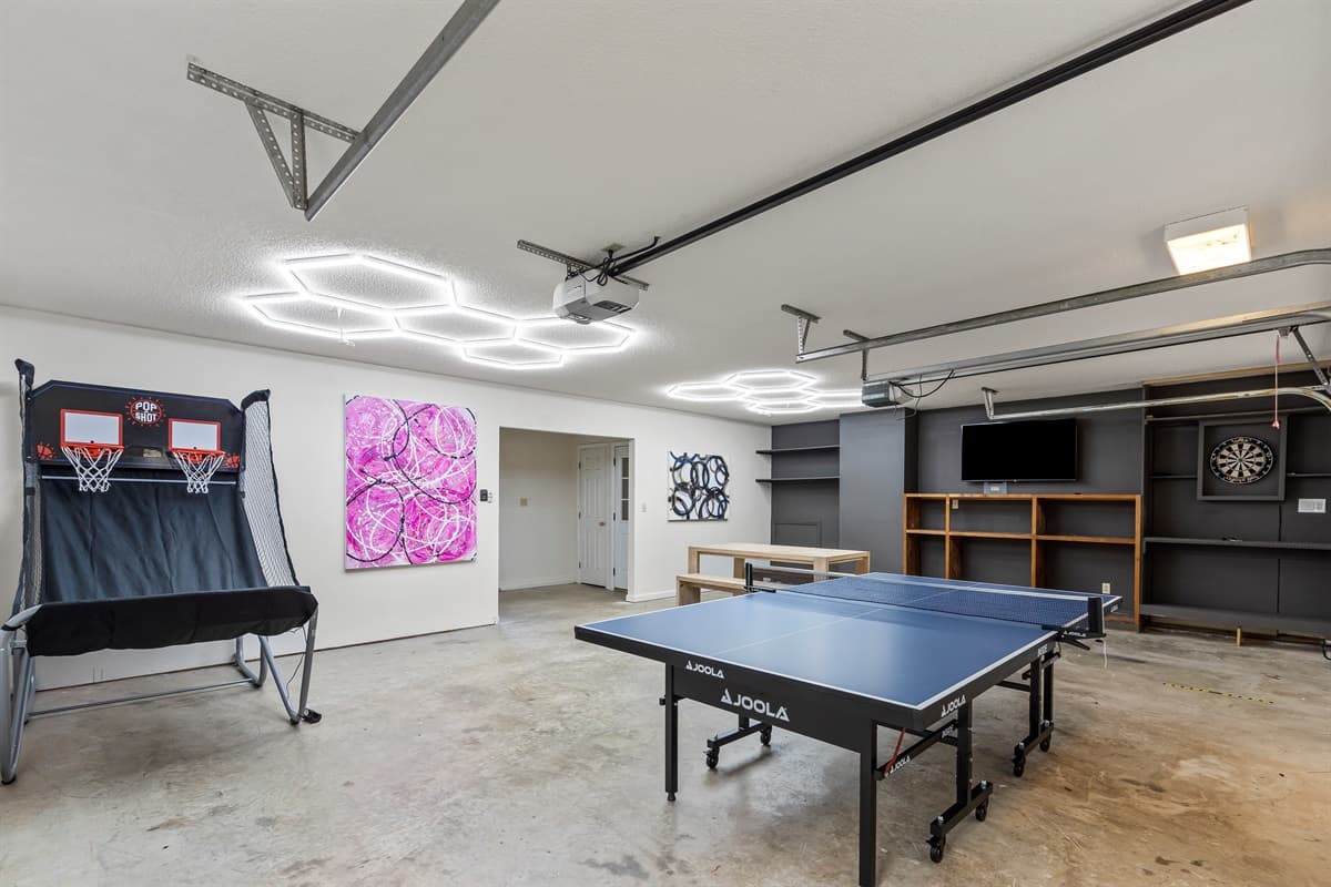 Fully setup with a game room - ping pong table, basketball, darts, TV, and board games.