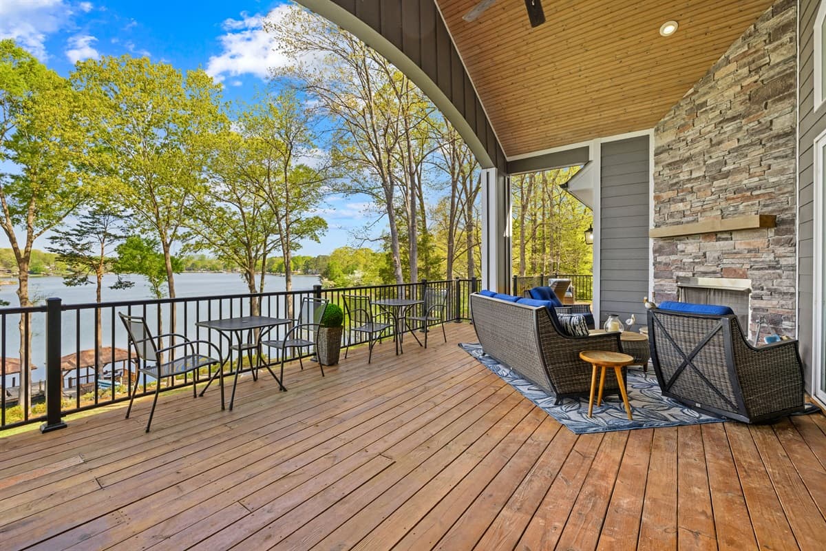 Covered deck seating overlooking the water, ideal for morning coffee or evening relaxation.