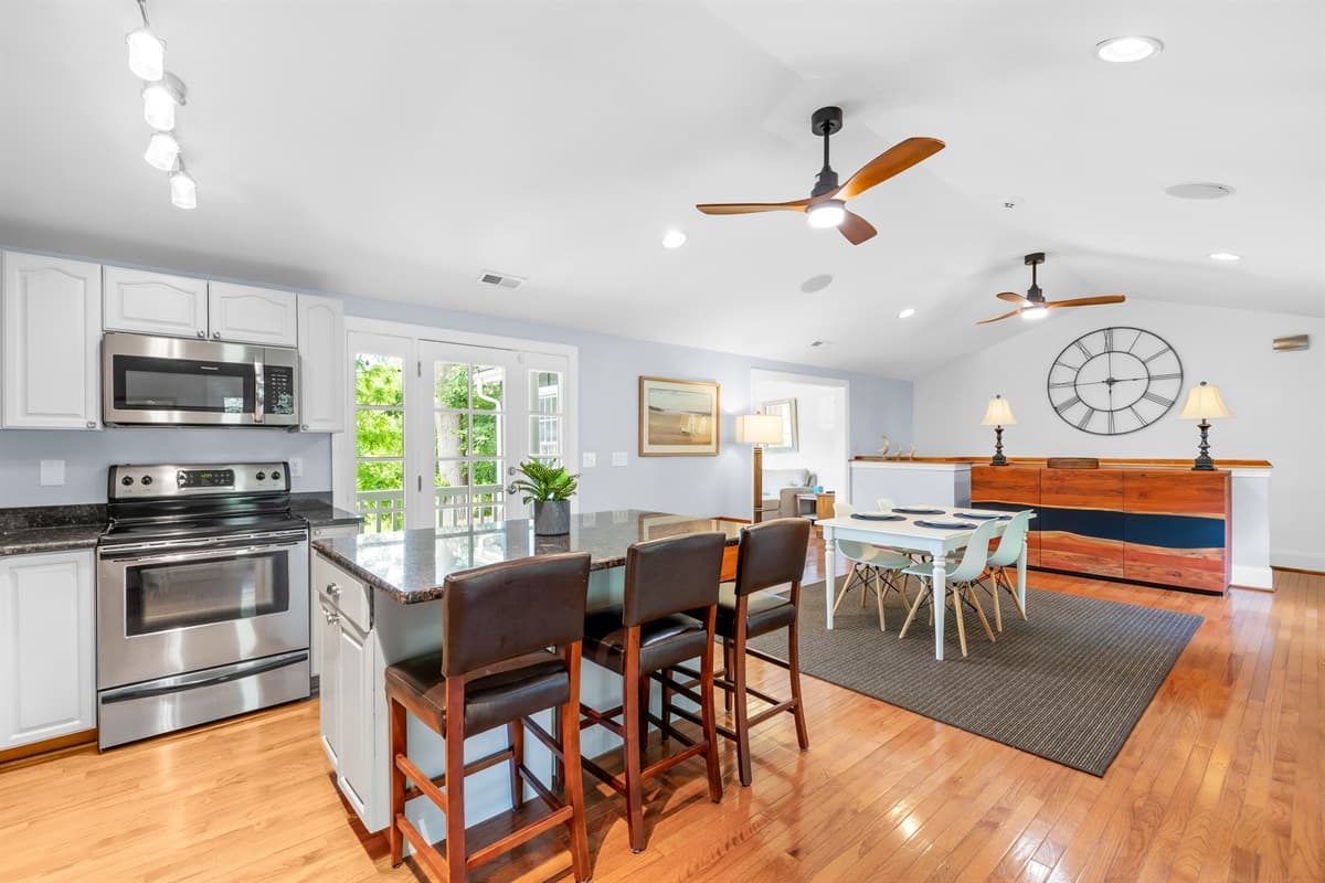 Fully stocked kitchen complete with modern appliances and cookware. 