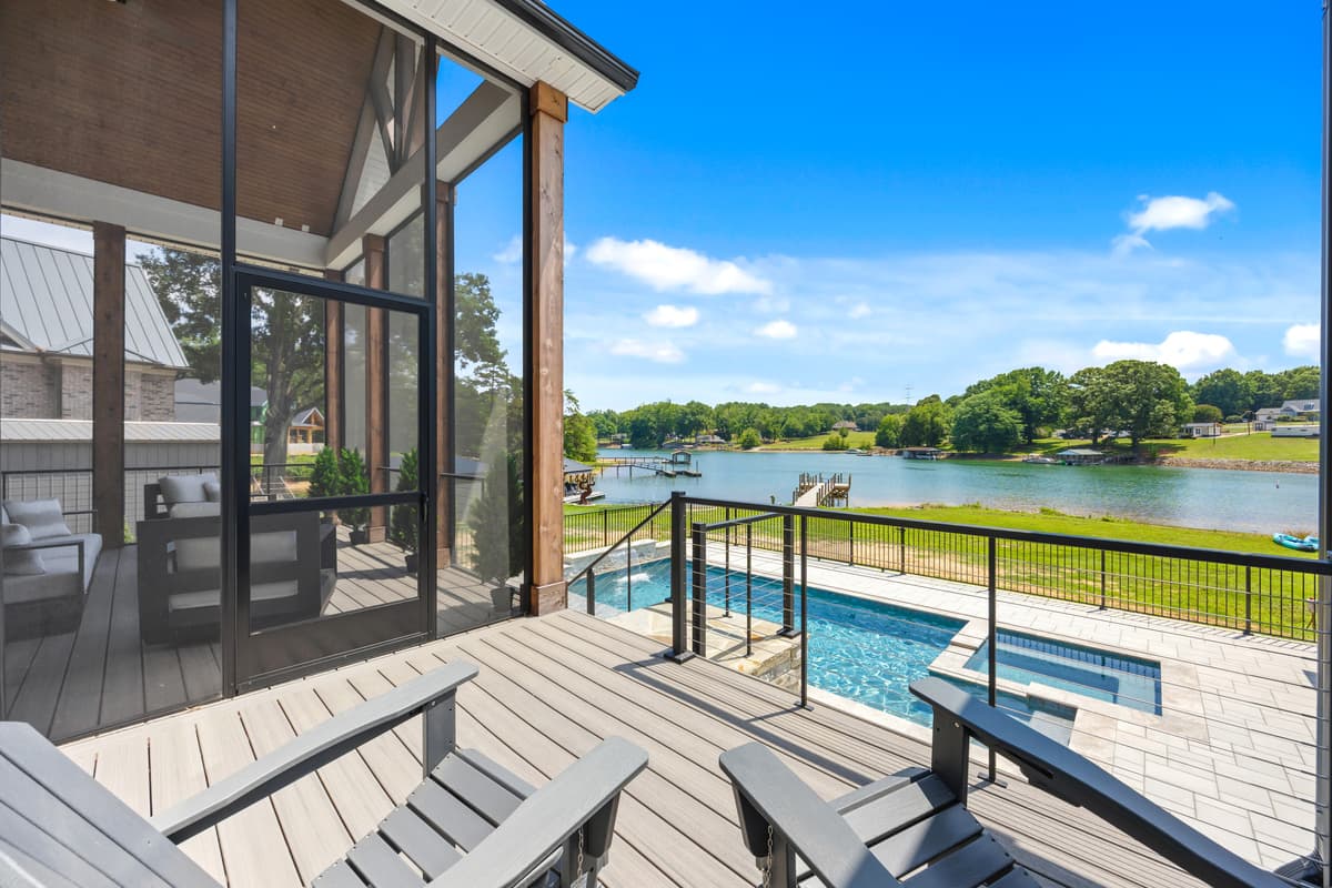 Step out onto the deck and let the lake take your breath away — wire railings keep the view wide open from sunrise coffee to sunset cocktails.